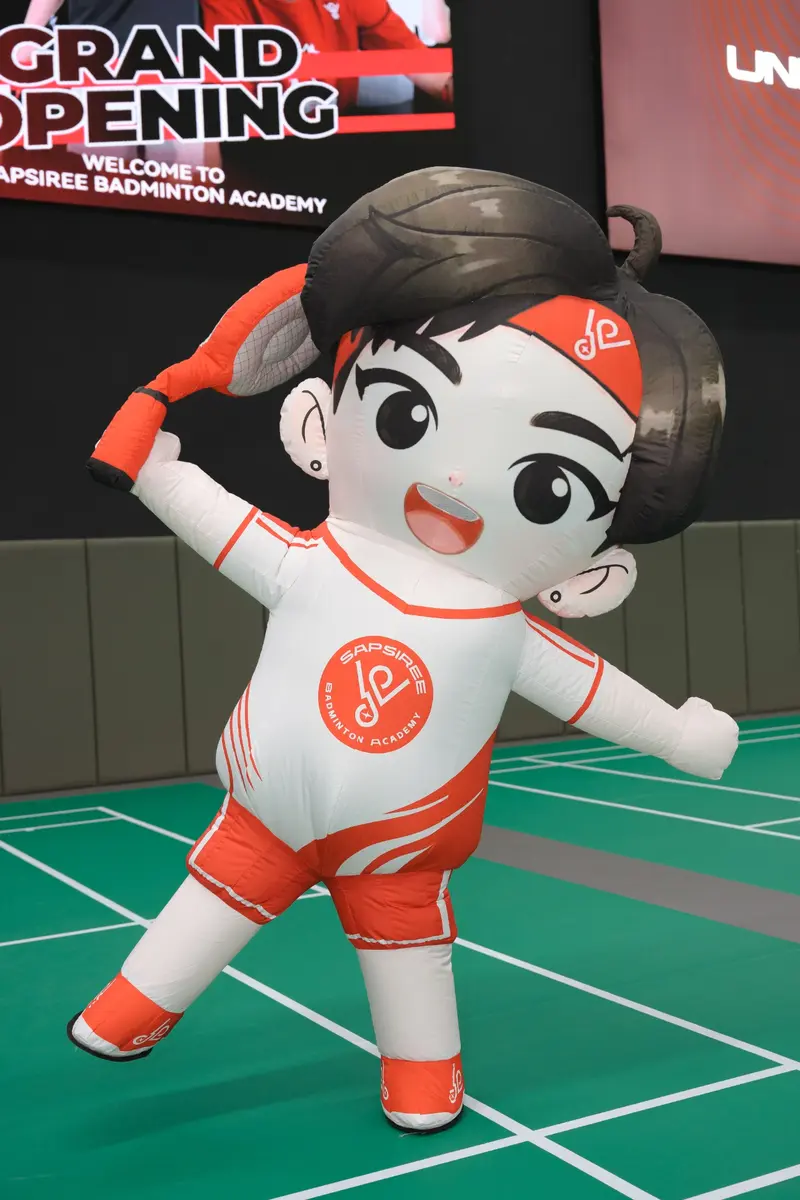 Sapsiree Badminton Academy mascot on the professional green court