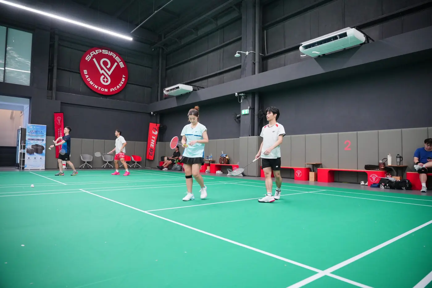 Players practising movement and match skills on an SBA court